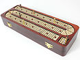 Front view of cribbage board inlaid with white maple on bloodwood box